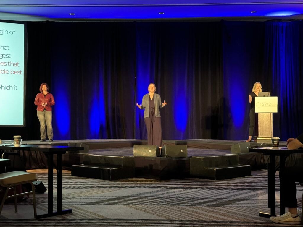 Three RedMonk Analysts on a keynote stage